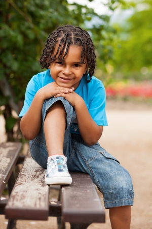 Outdoor portrait of a cute african american little boyの写真素材