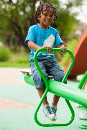 Outdoor portrait of a cute african american little boyの写真素材