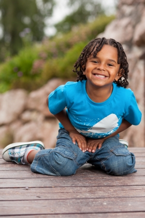 Outdoor portrait of a cute african american little boyの写真素材