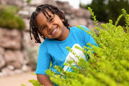 Outdoor portrait of a cute african american little boyの写真素材