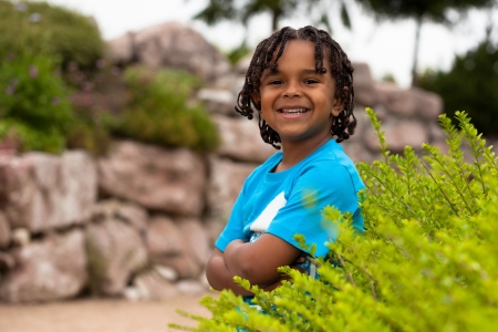 Outdoor portrait of a cute african american little boyの写真素材