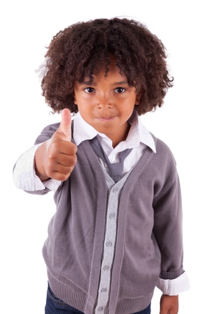 Portrait of a cute african little boy making thumbs up,isolated on white backgroundの写真素材