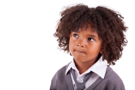 Portrait of a thoughtful african american little boy,isolated on white backgroundの写真素材