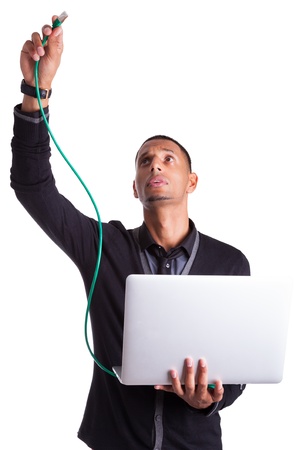 Young african american computer scientist plugin a ethernet cable, isolated on white backgroundの写真素材
