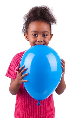 Portrait of a cute young African American girl holding a blue balloon,isolated on white backgroundの写真素材