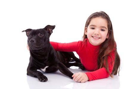Little caucasian girl with her pet, isolated on white backgroundの写真素材