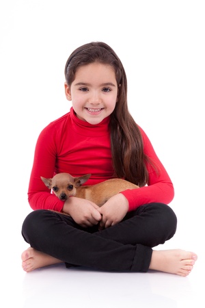 Little caucasian girl with her pet, isolated on white backgroundの写真素材