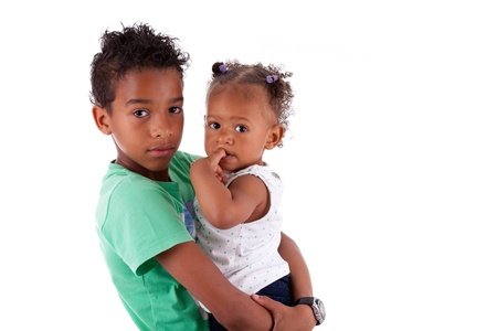 Portrait of a African American brother and sister, isolated on white backgroundの写真素材