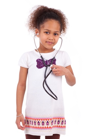 Young african asian girl holding a stethoscope, isolated on white backgroundの写真素材