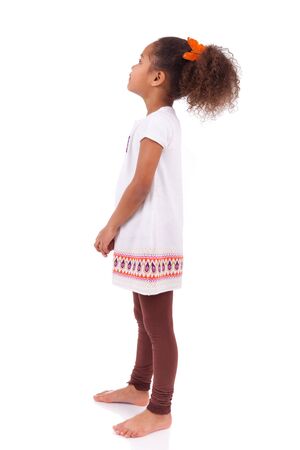 African Asian girl looking to something, isolated on white backgroundの写真素材