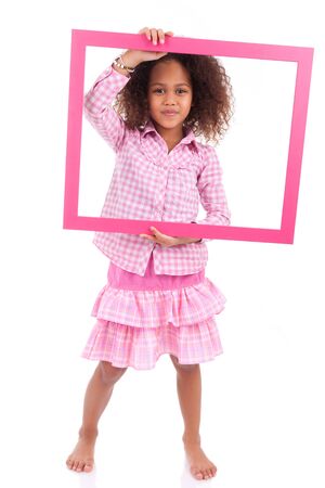 Portrait of a cute little african american girl, holding a picture frame,isolated on white backgroundの写真素材