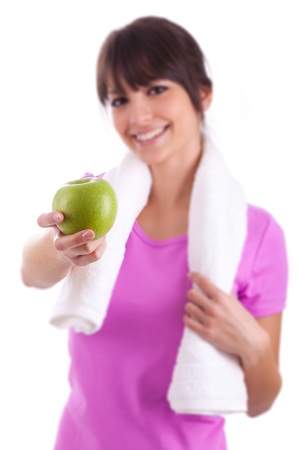 Young caucasian woman holding  an apple over white backgroundの写真素材