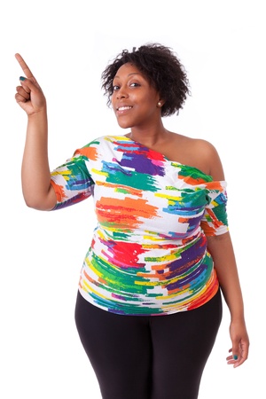 Young black woman pointing up, isolated on white background - African peopleの写真素材