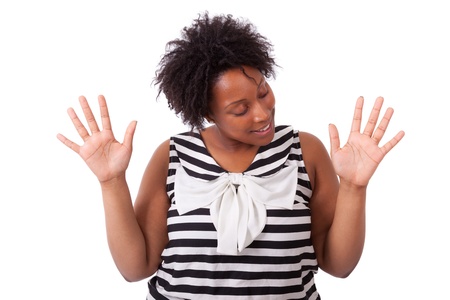 Young black woman showing her  hands palm, isolated on white background - African peopleの写真素材