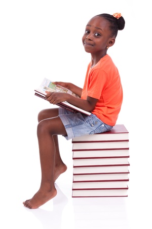Cute black african american little girl reading a book, isolated on white background - African people - Childrenの写真素材