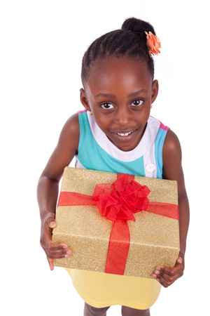 Young African American little girl holding a gift box, isolated on white backgroundの写真素材
