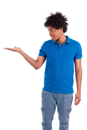 Portrait of a young african american man holding something, isolated on white background - Black peopleの写真素材