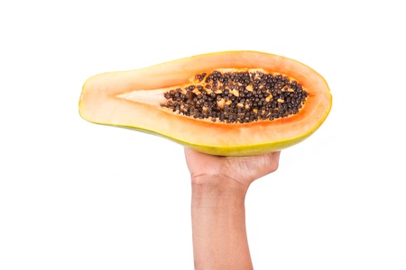 black   african american woman holding fresh papaya isolated on white backgroundの写真素材
