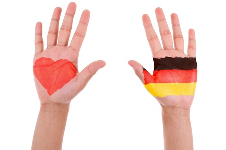 Hands with a painted heart and german flag, i love germany concept, isolated on white backgroundの写真素材