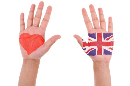 Hands with a painted heart and united kingdom flag, i love uk concept, isolated on white backgroundの写真素材