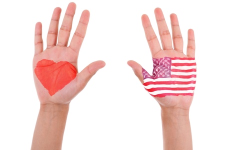 Hands with a painted heart and united states flag, i love usa concept, isolated on white backgroundの写真素材