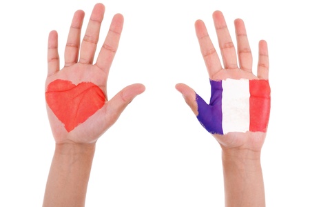 Hands with a painted heart and french flag, i love france concept, isolated on white backgroundの写真素材