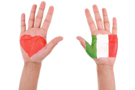 Hands with a painted heart and italian flag, i love italy concept, isolated on white backgroundの写真素材