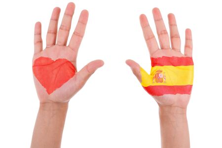 Hands with a painted heart and spanish flag, i love spain concept, isolated on white backgroundの写真素材