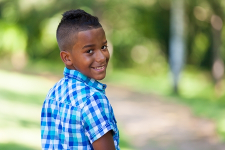 Outdoor portrait of a cute teenage black boy - African peopleの写真素材