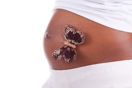 Young pregnant black woman belly, isolated on white background - African peopleの写真素材