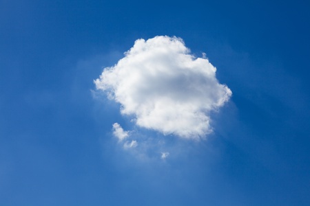 Blue sky background with white cloudsの写真素材