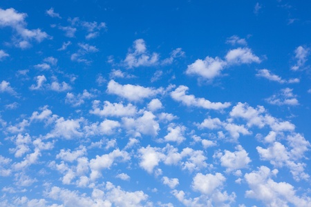 Blue sky background with white cloudsの写真素材