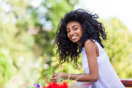 Outdoor portrait of a smiling teenage black girl - African peopleの写真素材