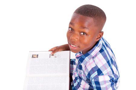 African American school boy reading a book, isolated on white background - Black peopleの写真素材