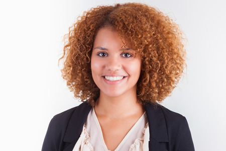 Portrait of a young african american business woman, isolated on white background - Black peopleの写真素材