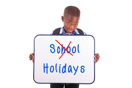 African American school boy holding a blank board, isolated on white background - Black peopleの写真素材