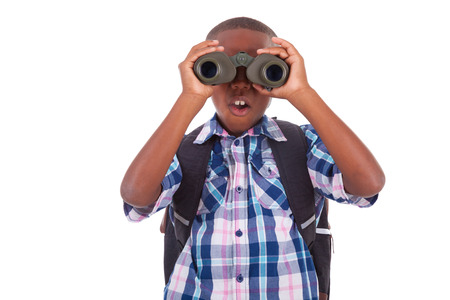 African American school boy using binoculars, isolated on white background - Black peopleの写真素材