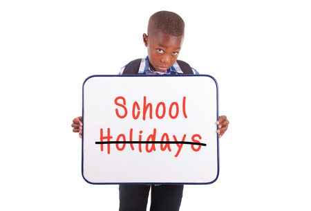 African American school boy holding a blank board, isolated on white background - Black peopleの写真素材