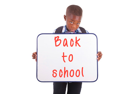 African American school boy holding a blank board, isolated on white background - Black peopleの写真素材