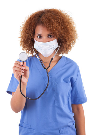 African American nurse holding a stethoscope, isolated on white background - Black peopleの写真素材