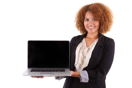 African American business woman holding a laptop, isolated on white background - Black peopleの写真素材
