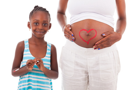 Little african american girl painting on her mother's belly, isolated on white background - African peopleの写真素材