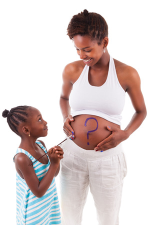 Little african american girl painting on her mother's belly, isolated on white background - African peopleの写真素材