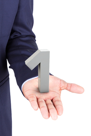 Business man holding a 3d number in hand palm, isolated on white backgroundの写真素材