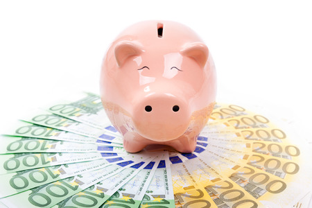 Piggy bank with euro billsの写真素材