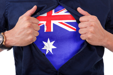 Young sport fan opening his shirt and showing the flag his country Australia - Australian flagの写真素材