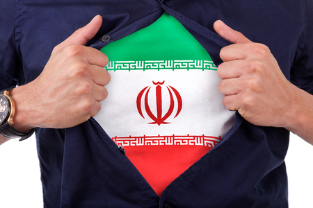 Young sport fan opening his shirt and showing the flag his country iran, iranian flagの写真素材