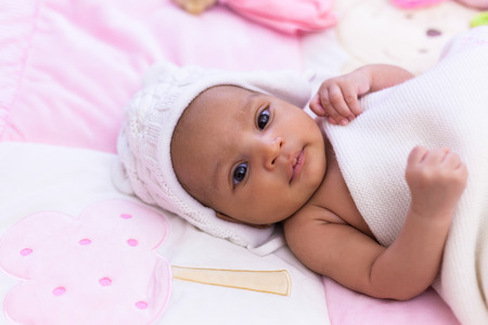 Adorable little african american baby girl looking - Black peopleの写真素材