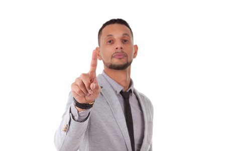 African American business man touching a transparent screen - Black people, isolated on white...