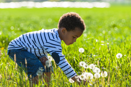 Cute african american little boy playing outdoor - Black peopleの写真素材